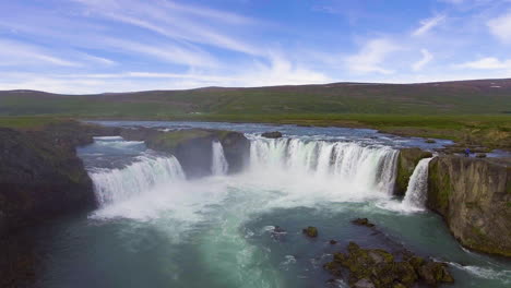 drone aerial footage of the godafoss waterfall in north iceland.