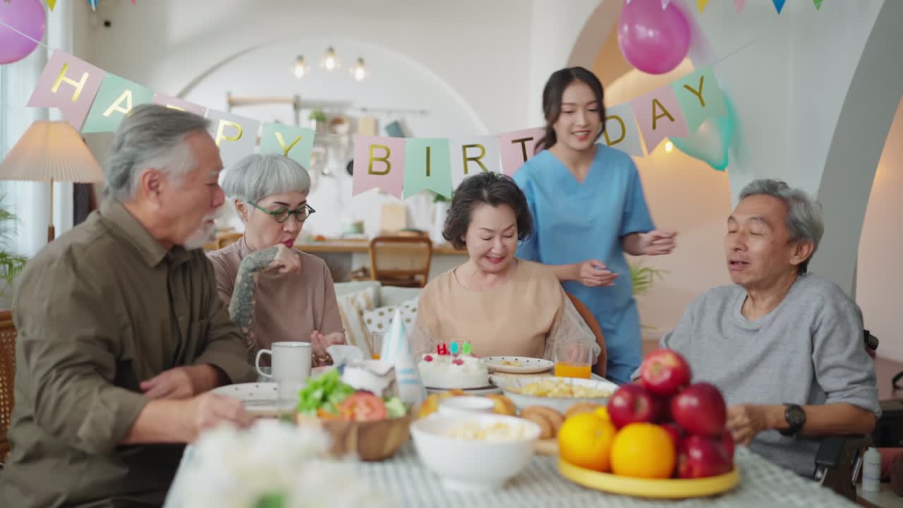 birthday party at senior daycare,group of asian female elder male female laugh smile positive conversation greeting in birthday friend party at nursing home senior daycare center Senior woman birthday