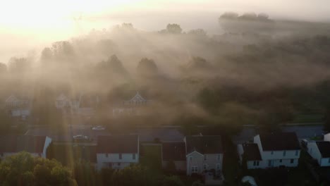 aerial of residential homes at dawn, daybreak