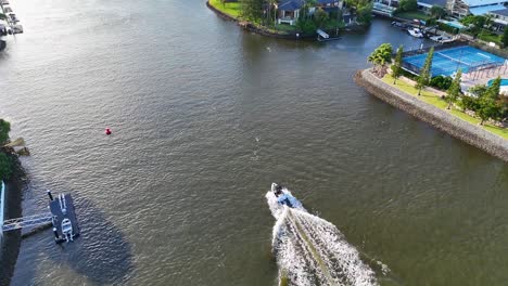 boat cruising along scenic river in queensland