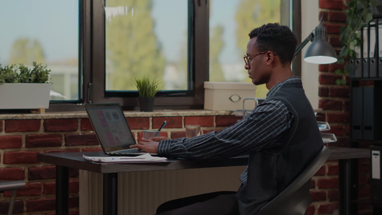 Cheerful employee finding out good news about successful work