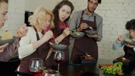 friends enjoying a cooking class meal