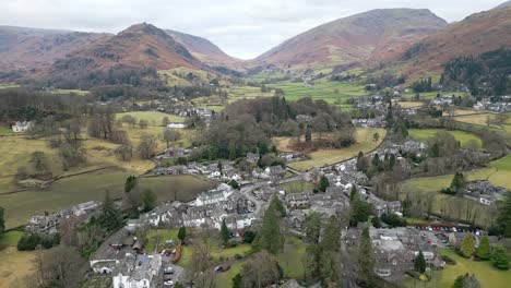 english landscape, aerial view of grassmere, village, town in the english lake district, uk