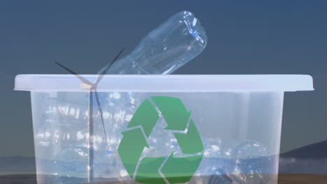 animación de un cartel de reciclaje verde sobre una caja con botellas de plástico y una turbina eólica