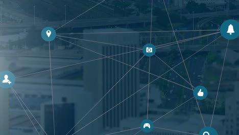 animation of digital icons with network of connections over cityscape