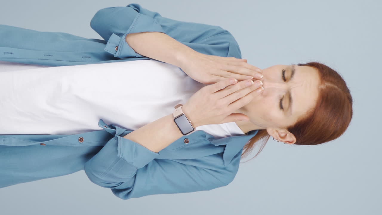 Vertical video of The sick woman can't stop coughing.