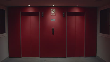 red elevator doors at night