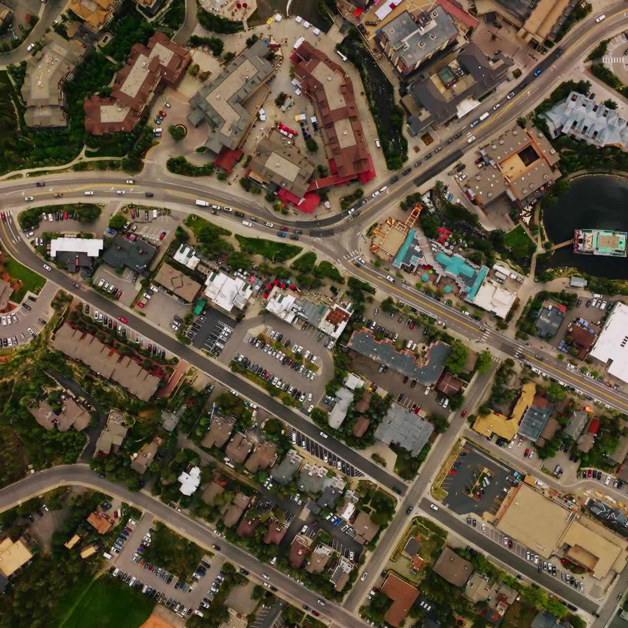Densely built little town of American state of Colorado. Aerial view of the busy streets of resort town in summer season