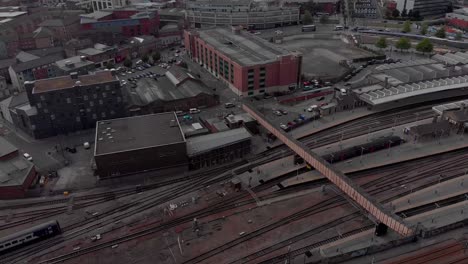 drone flying above sheffield city summer sunny day 4k train station sheffield hallam vivid traffic and trains travelling away from the city revealing the city