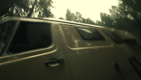 van driving through a forest