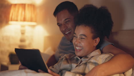 tablet, funny and couple in bedroom at night