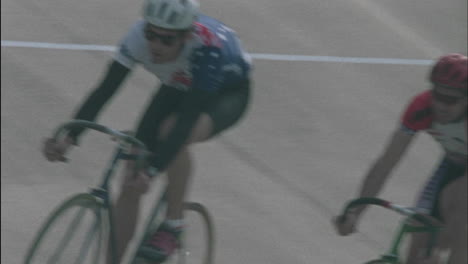 cyclist in line race around a track