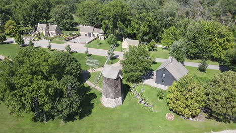 greenfield village with old homes and millhouse, aerial view