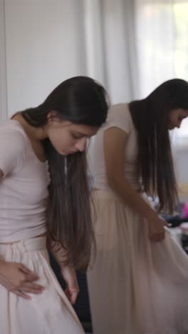 young woman trying on clothes