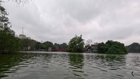calm waters and greenery around hoan kiem lake