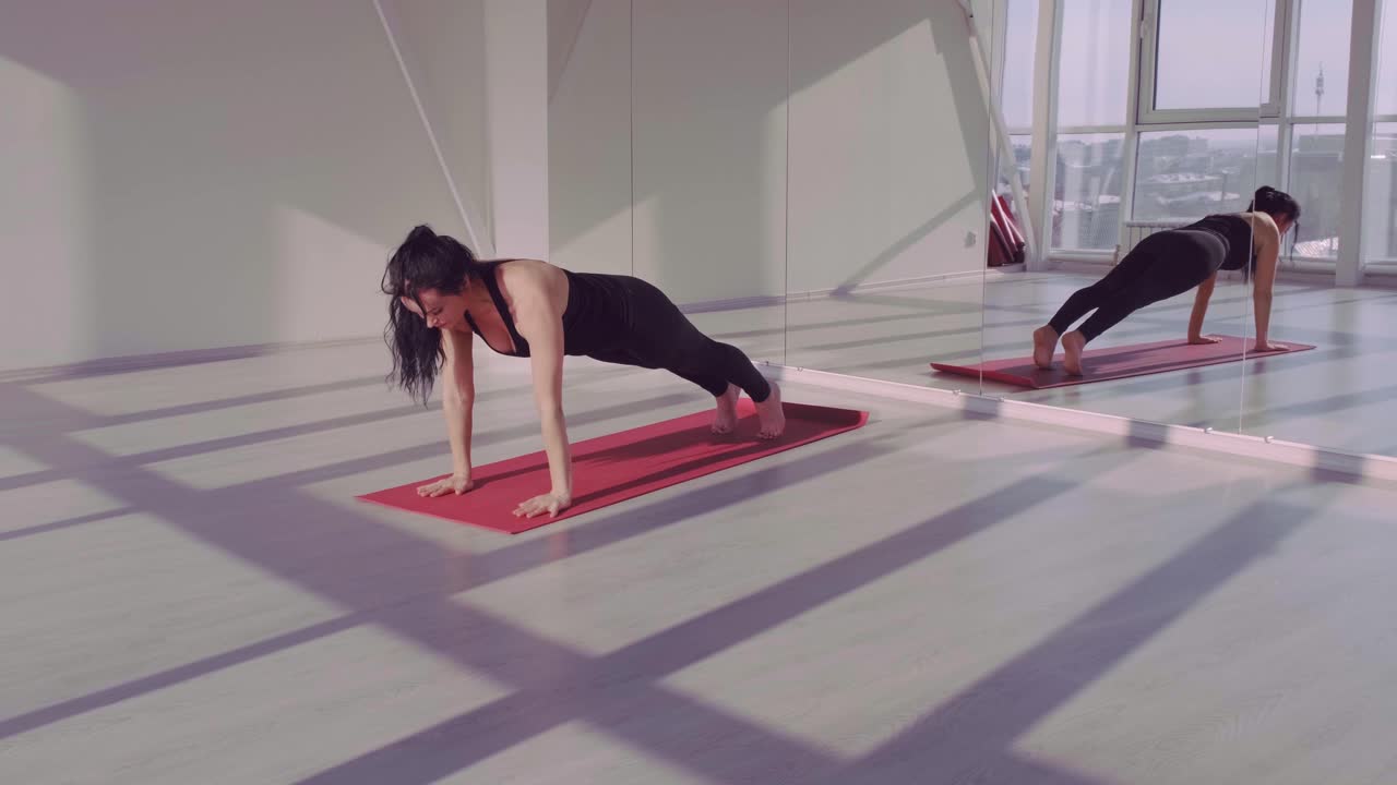 A Journey of Transformation: From Mindful Standing to Empowering Cobra Pose in a Beautifully Lit Yoga Studio Setting