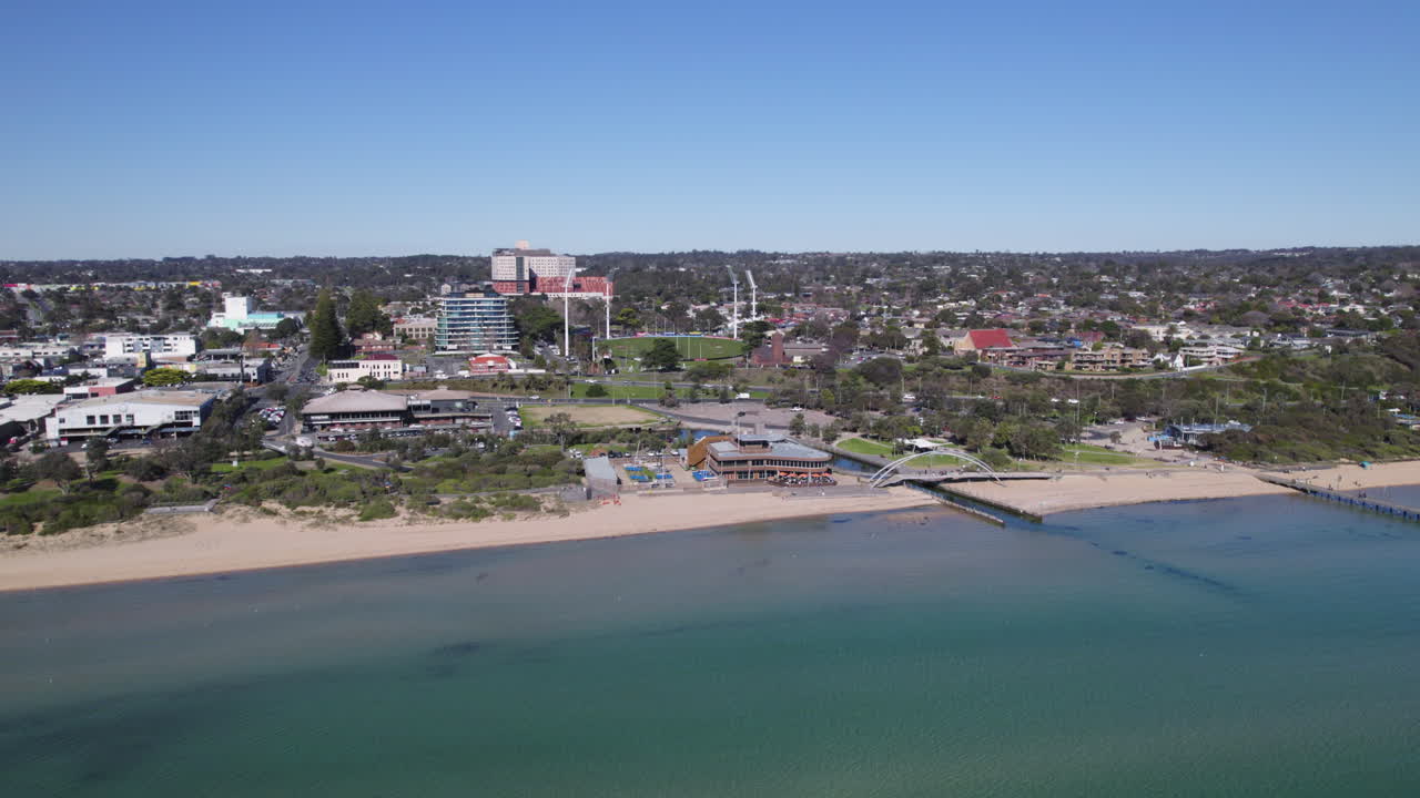 Establishing aerial Frankston Yacht Club and beach, sunny Victoria, Australia