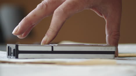 inserting cassette into compartment of a portable player