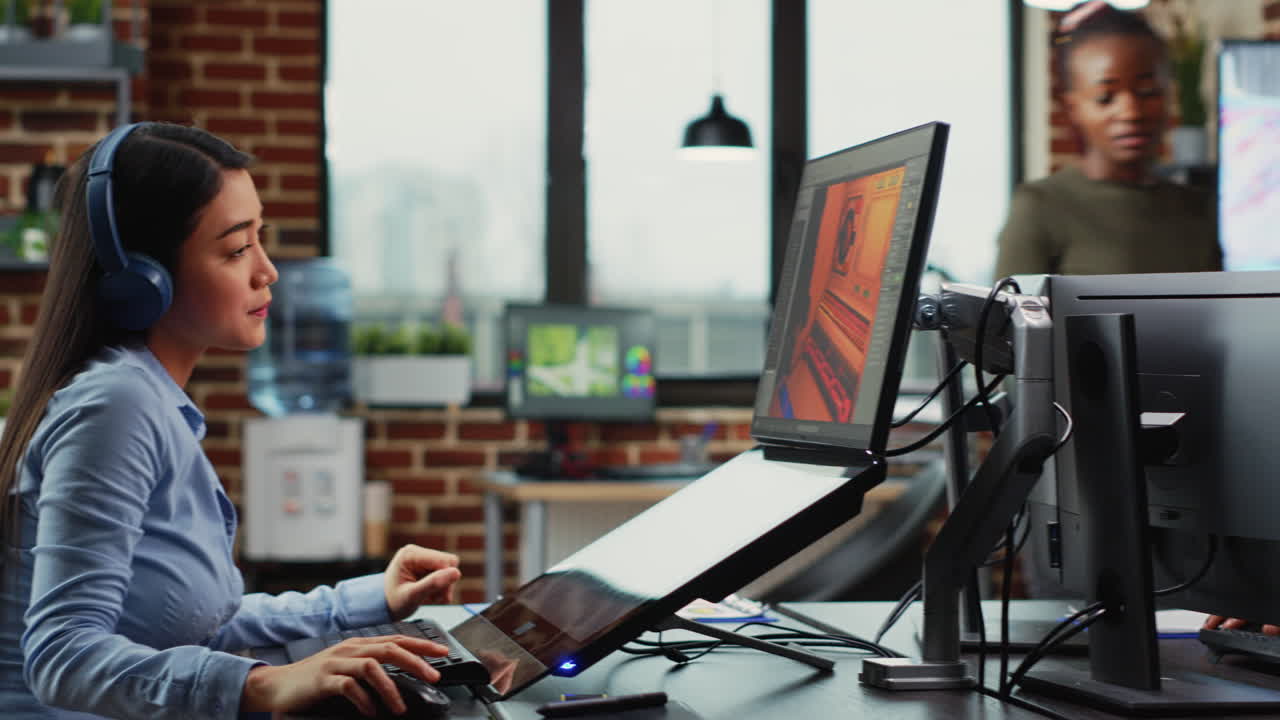 Multiethnic group of employees creating 3d project at office workstation