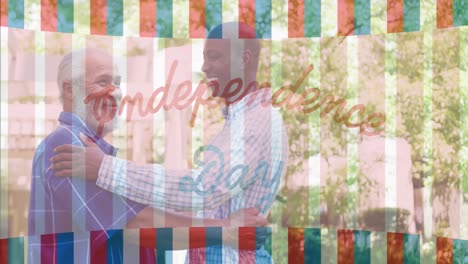 Independence-day-text-banner-against-two-diverse-senior-men-hugging-each-other