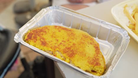 Local-Tenerife-Cachapa-food-for-take-away-in-plastic-container,-close-up-view