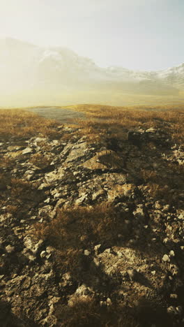 Majestic rocky landscape at dawn with mountains under soft golden light
