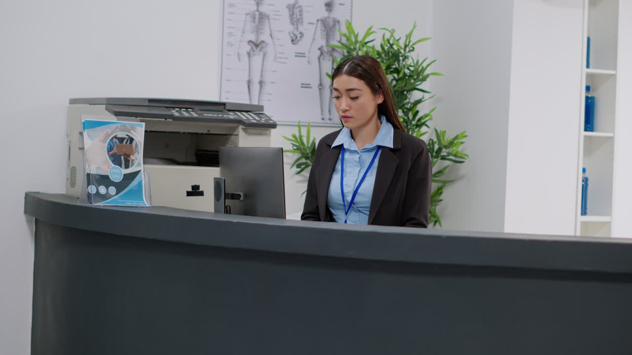 Medical office reception with nurse and receptionist