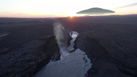 icelandic waterfall with ufo at sunset