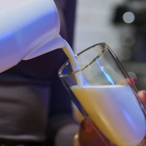 hands of barista making coffee in bar
