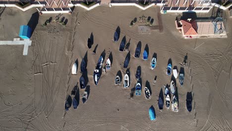 Boats-Fuengirola-top-down-drone-aerial-view-of-beach,-coastline-with-city