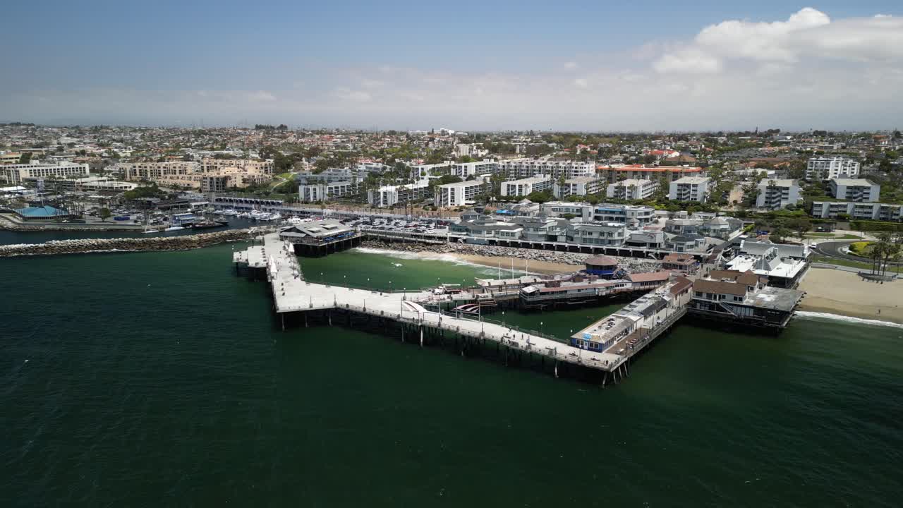 Aerial 4K drone footage of Redondo Beach Pier in Los Angeles, California, showcasing the Pacific Ocean, coastline, marina, and iconic waterfront landmark from scenic elevated views