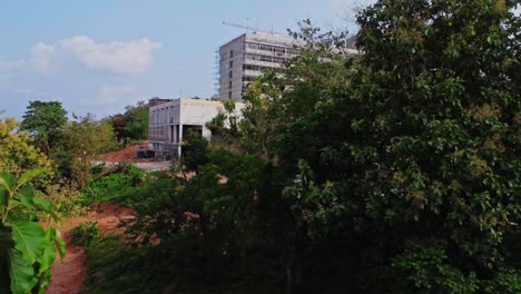 a beautiful hotel hidden behind green trees under renovation in ibadan, nigeria
