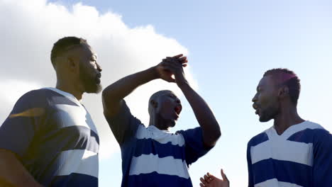 clapping and cheering, african american male athletes celebrating and victory on field, copy space