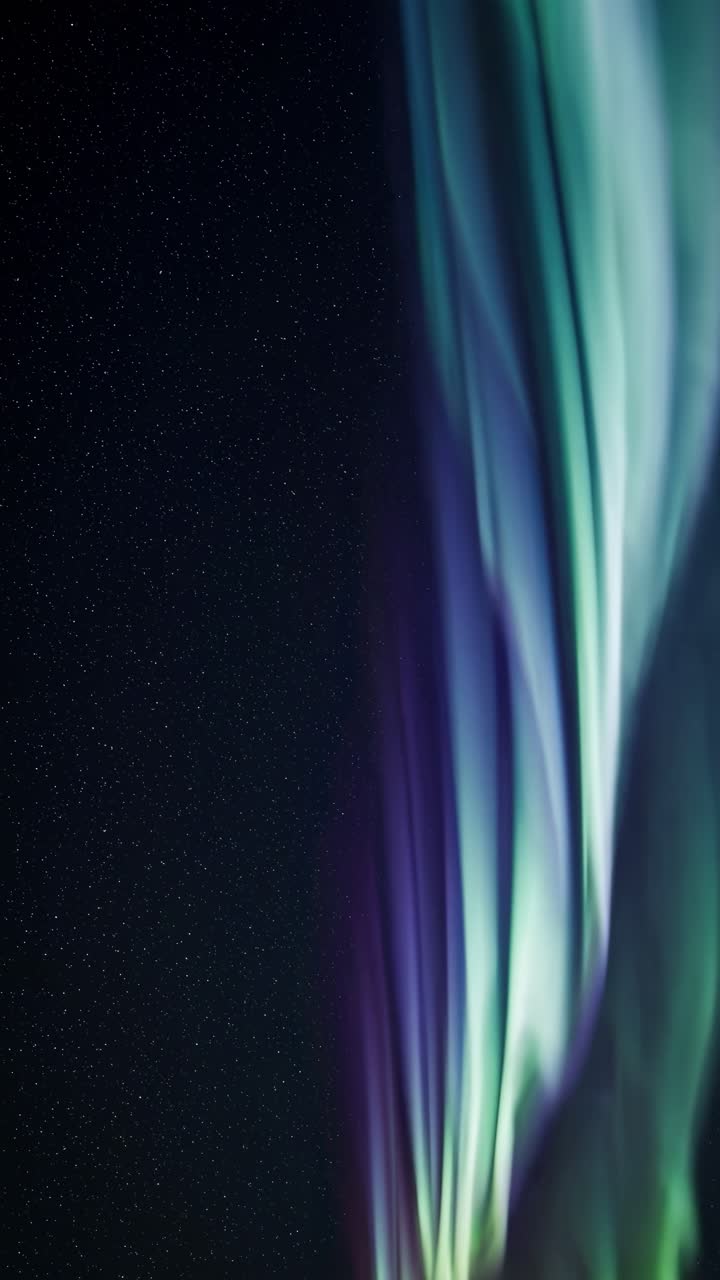 Vibrant Aurora Borealis Against a Starry Night Sky