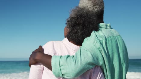 senior couple looking at the beach