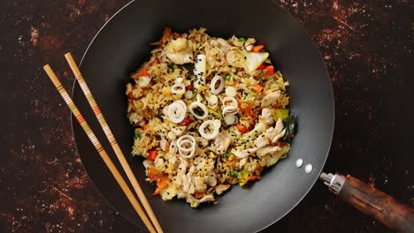 delicious fried rice with chicken in wok