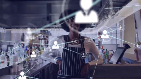 Network-of-profile-icons-against-portrait-of-african-american-bartender-smiling-at-a-bar