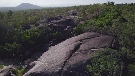 fabulous rock landscape of massive boulders with green foliage at granite gorge nature park in mareeba, queensland