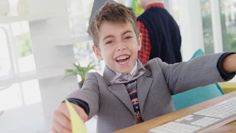 Excited-boy-playing-with-sticky-notes-4k