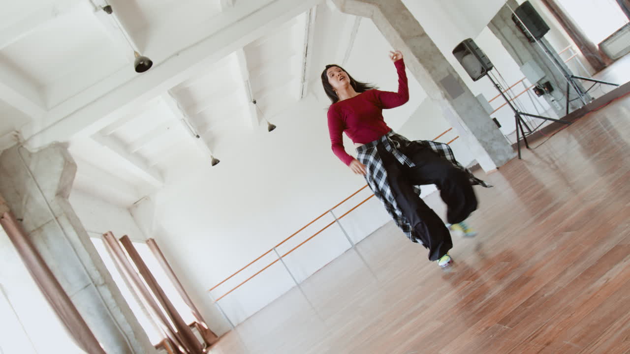 Young Woman Dancing in a Bright Dance Studio
