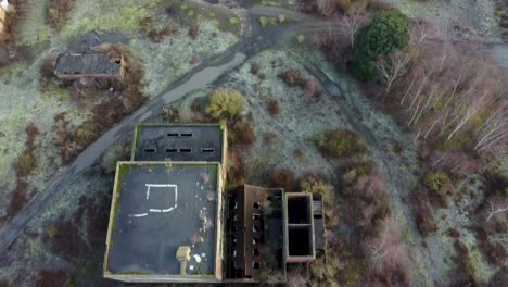 Flying-over-a-mine-shaft-in-an-abandoned-colliery-in-Kent,-England