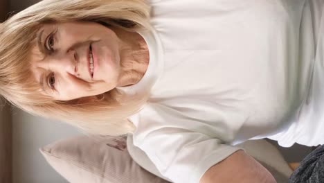 mature woman practicing meditation at home calm senior woman sitting on floor doing yoga smiling mature woman practicing meditation at home calm senior woman sitting on floor doing yoga for mental balance breathing air relaxing