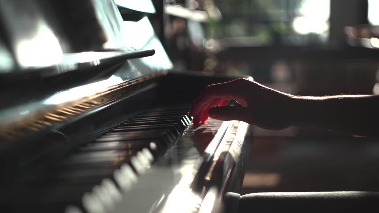 Male hand learning how to play the piano.