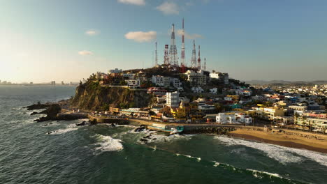 Mazatlán-Malecon-oceanfront-seawall-promenade,-golden-hour-in-Mexico---Aerial-view