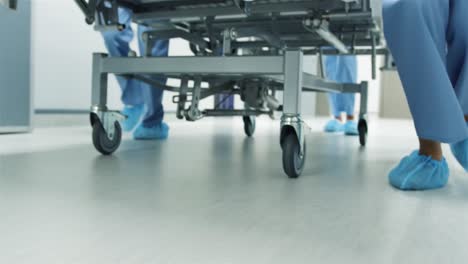 feet of staff moving hospital bed in an emergency 4k