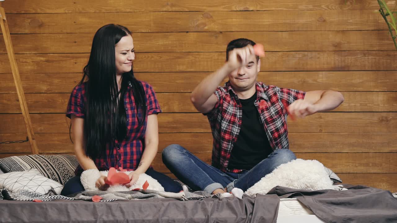 Portrait of happy young family. Studio shot of casual couple posing to camera at studio