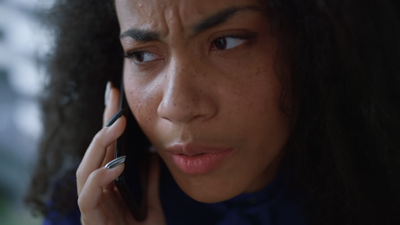 Sad entrepreneur woman using smart phone device talking client in office closeup