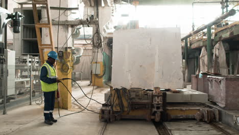 man transporting marble piece