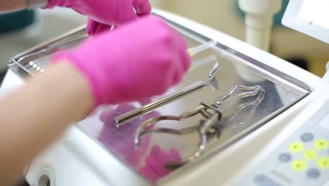 dental procedure with pink gloves