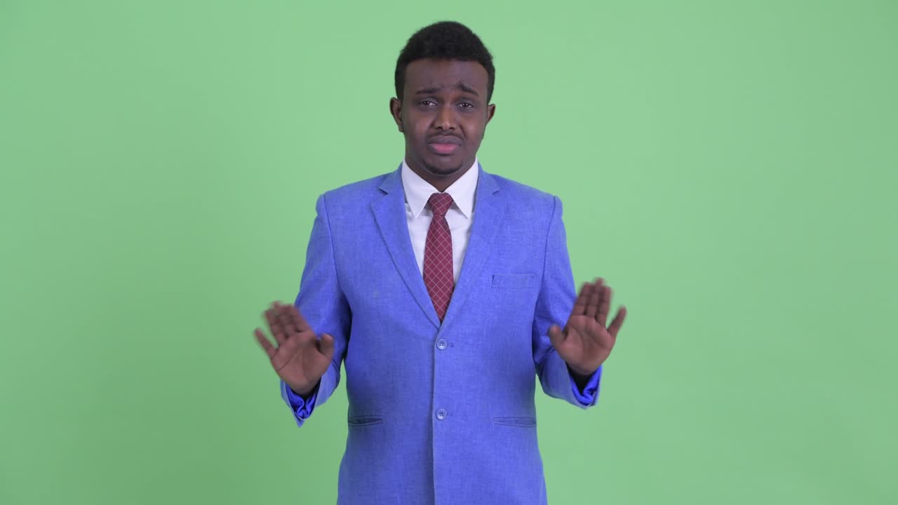 Young African businessman with Afro hair in suit